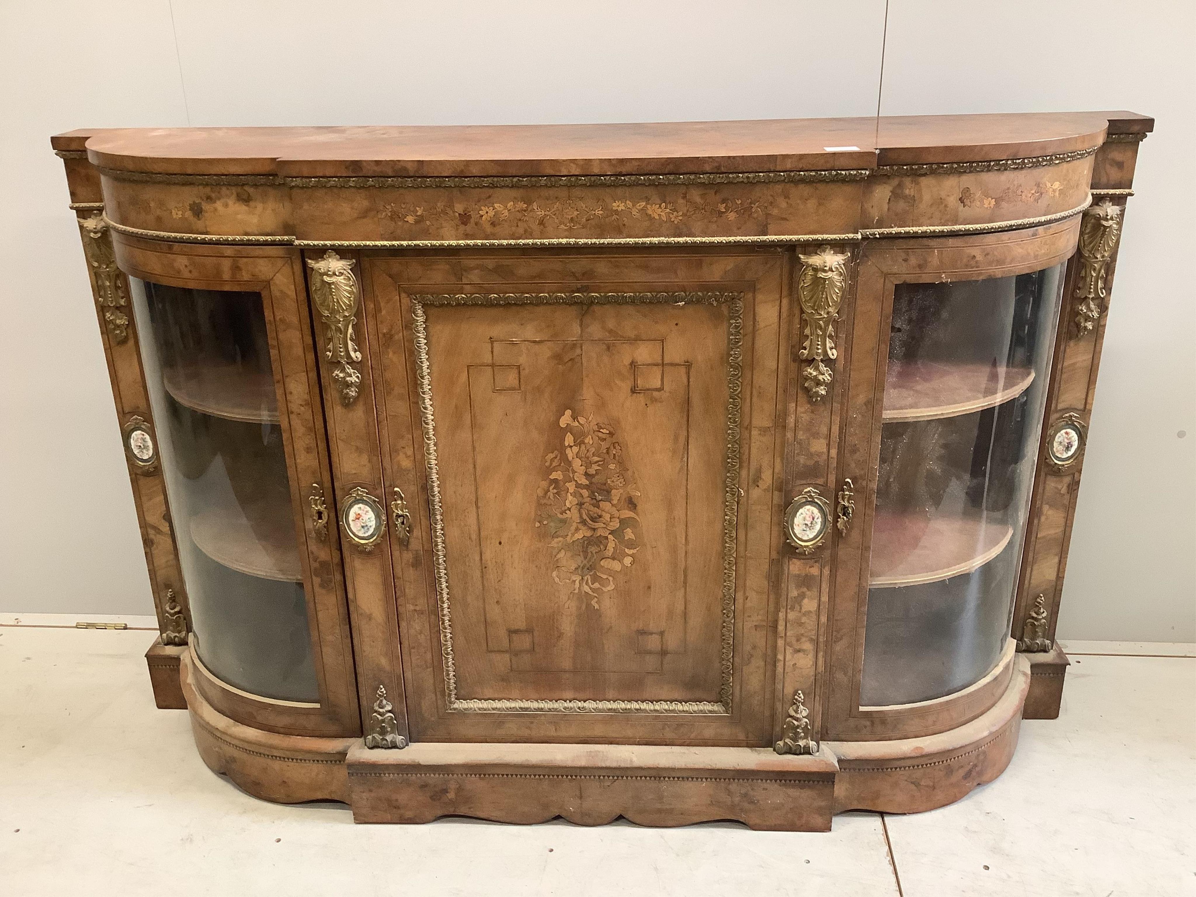 A Victorian marquetry inlaid, gilt metal mounted bowfront side cabinet